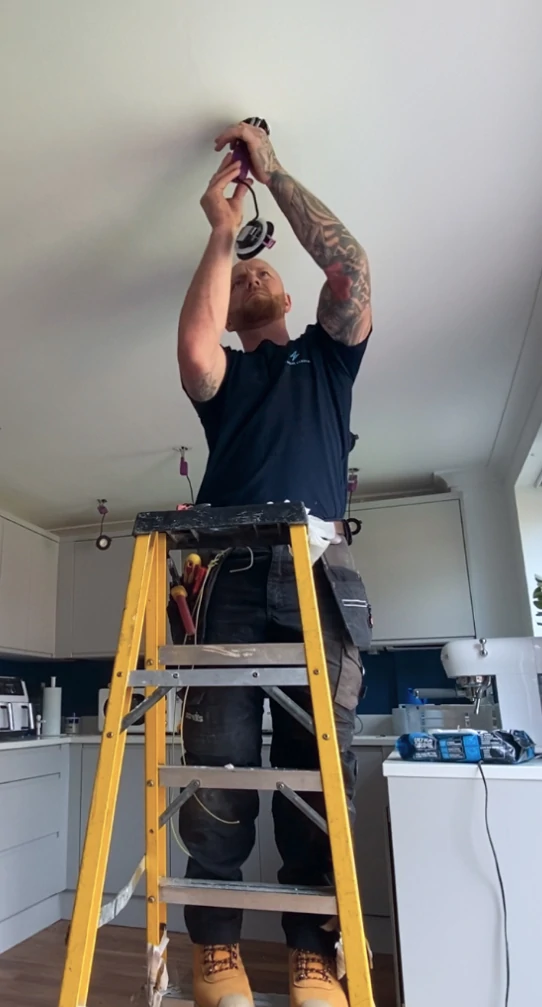Lightwork Electrical electrician working on-site in Cwmbran