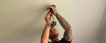 Domestic electrician working in a home