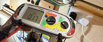 Electrician diagnosing an electrical fault
