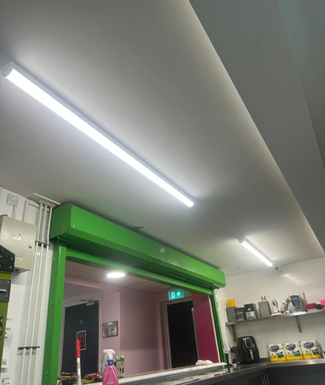 Commercial electrician carrying out electrical work