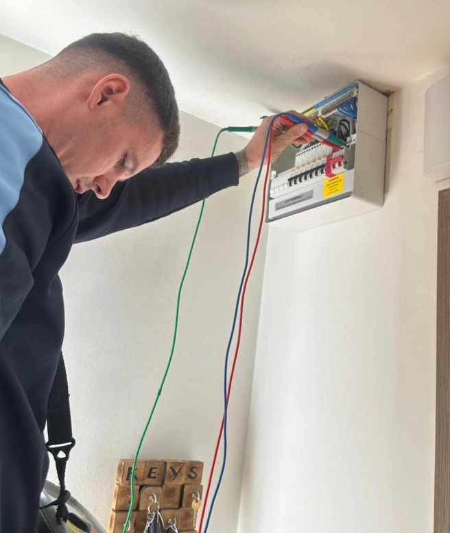 Electrician carrying out electrical fault finding