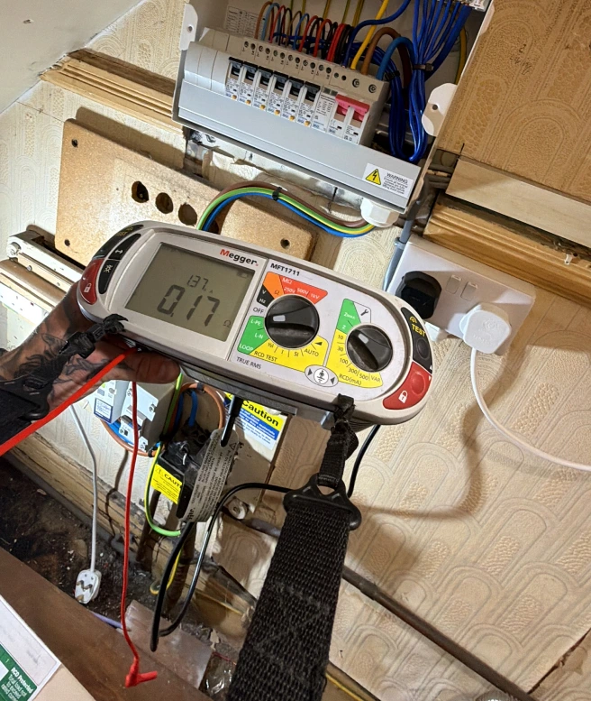Electrical inspection and testing being carried out