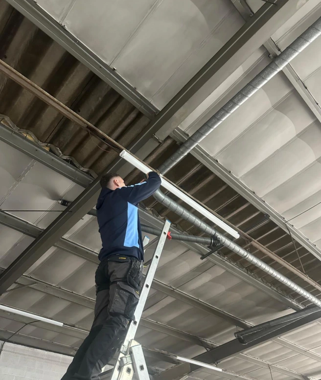 Electrician fitting a new light