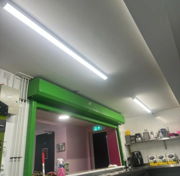 Commercial electrician carrying out electrical work