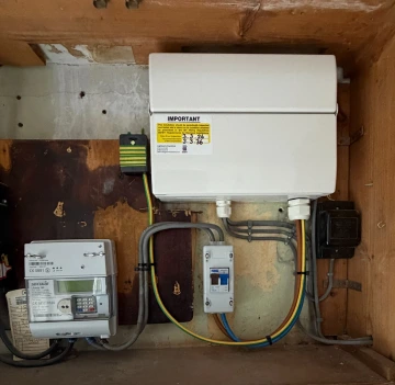 Electrician carrying out an electrical upgrade in South Wales