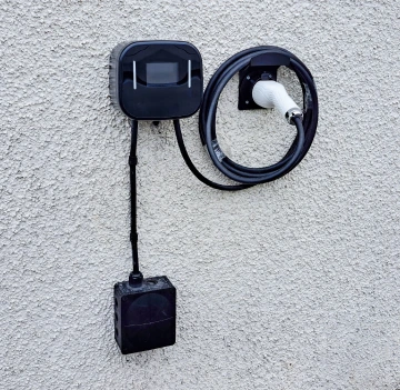 Electrician carrying out EV charger installation