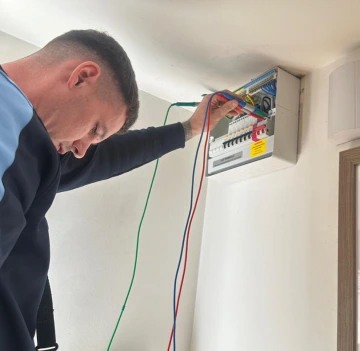 Electrician carrying out electrical fault finding